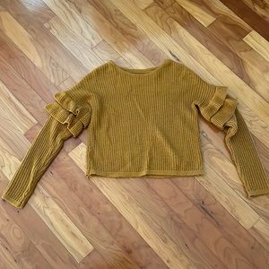 mustard sweater with ruffle sleeves